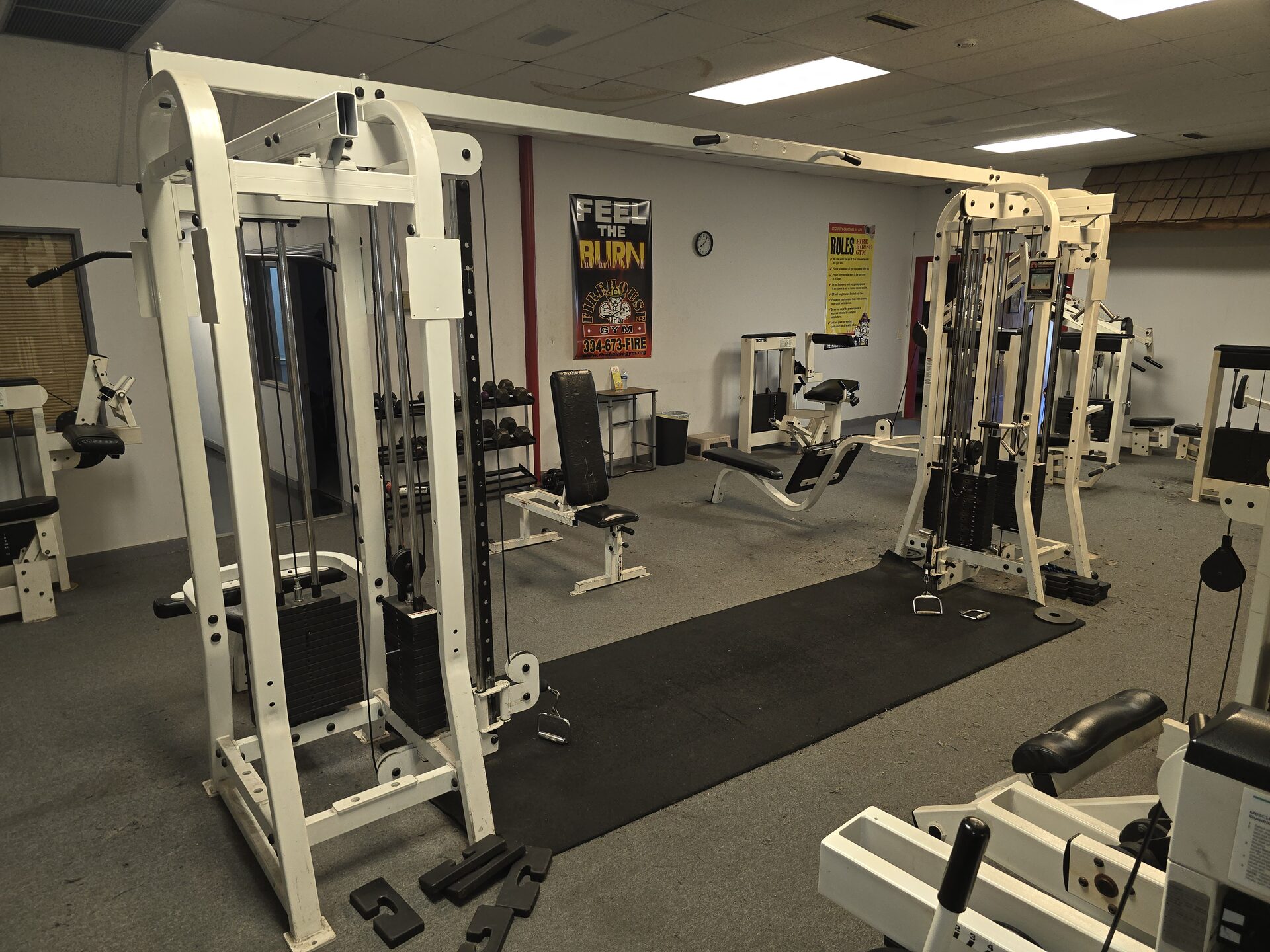 Fire House Gym floor with cable machines, benches and free weights