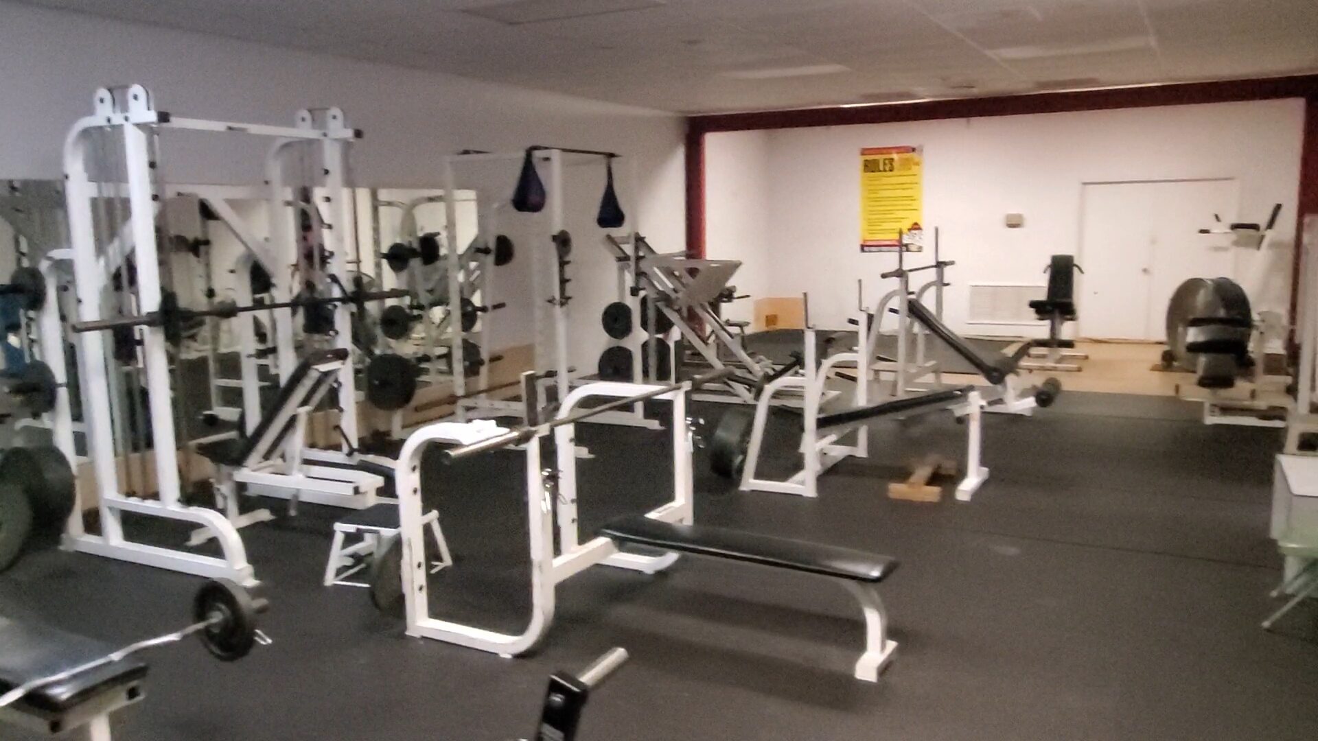 Fire House Gym free weight area with racks and benches